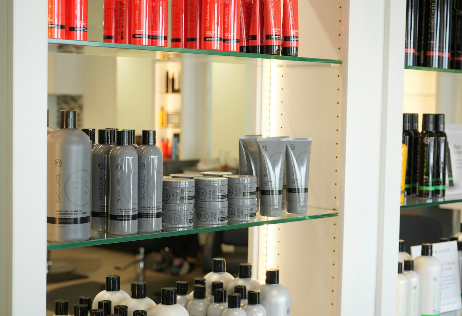 Haircare products are neatly displayed on shelves.